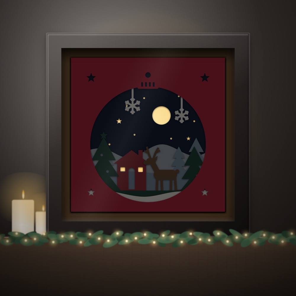 A finished paper shadow box glowing with fairy lights on a dark mantelpiece